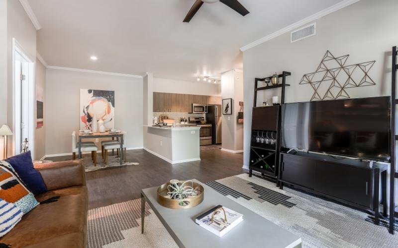 a living room with a tv and couches