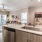 a kitchen with a sink and a refrigerator