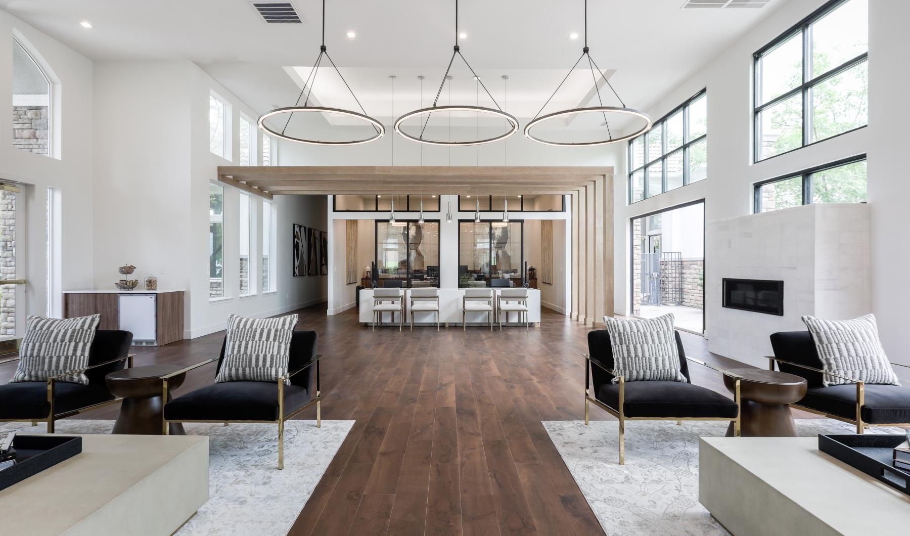 a large room with a chandelier and chairs