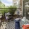 a patio with chairs and tables