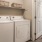 a laundry room with white appliances